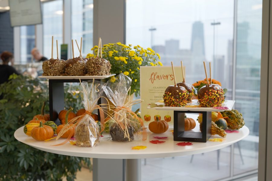 a table display of colorful caramel-dipped candy apples